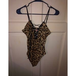 Leopard print onesie with cross stringed clevage